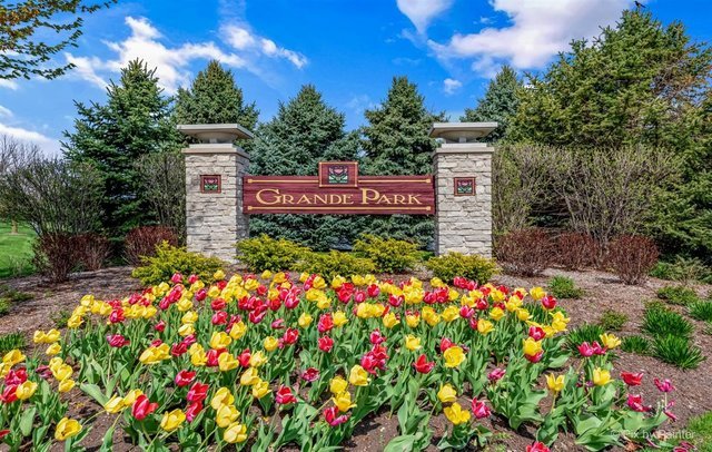 26428 Rustling Birch Way Plainfield, IL 60585 - Photo 45 of 49 a sign that is in front of flowers