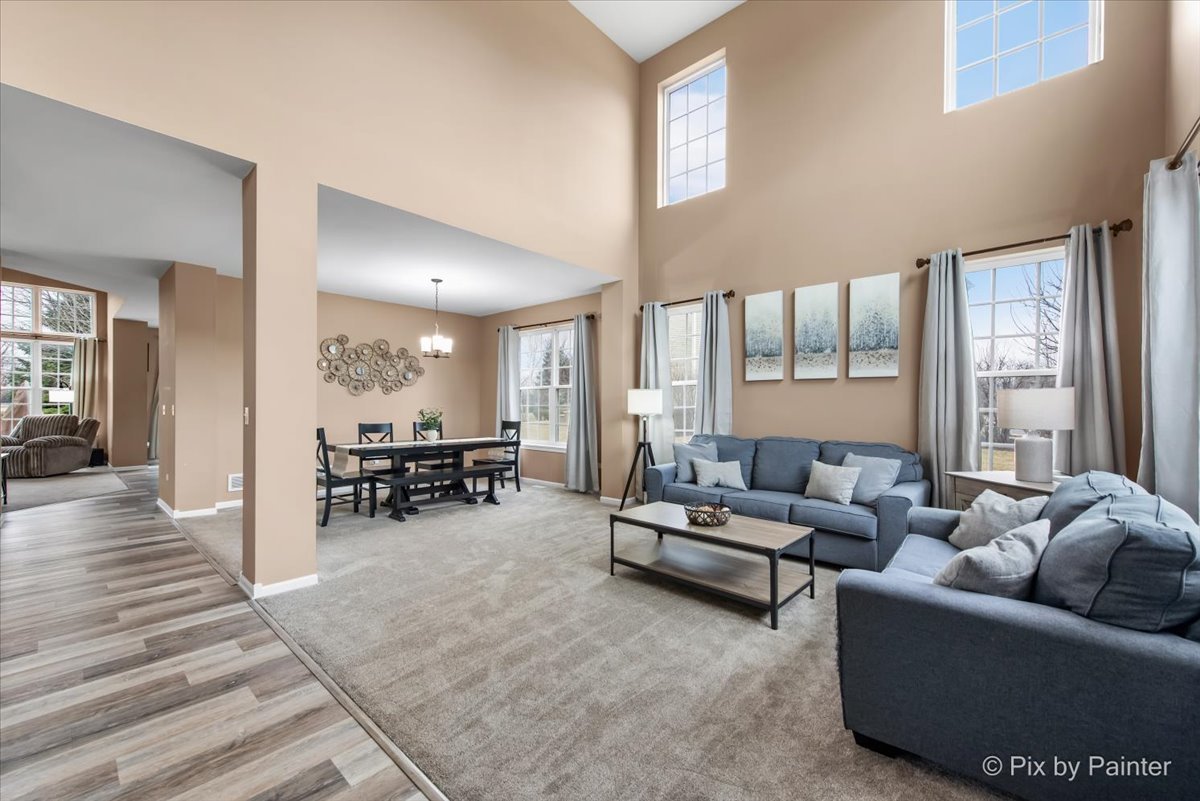 26428 Rustling Birch Way Plainfield, IL 60585 - Photo 8 of 49 a living room with furniture and wooden floor