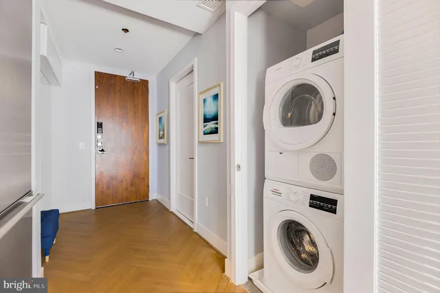 a view of a hallway with washer and dryer