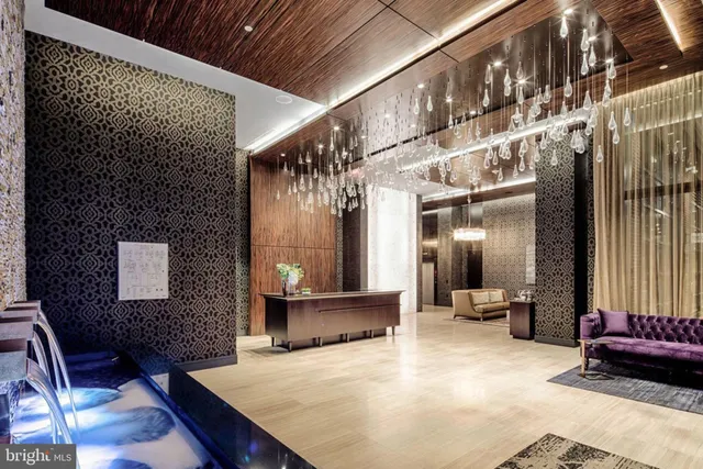 a view of a hallway with seating space