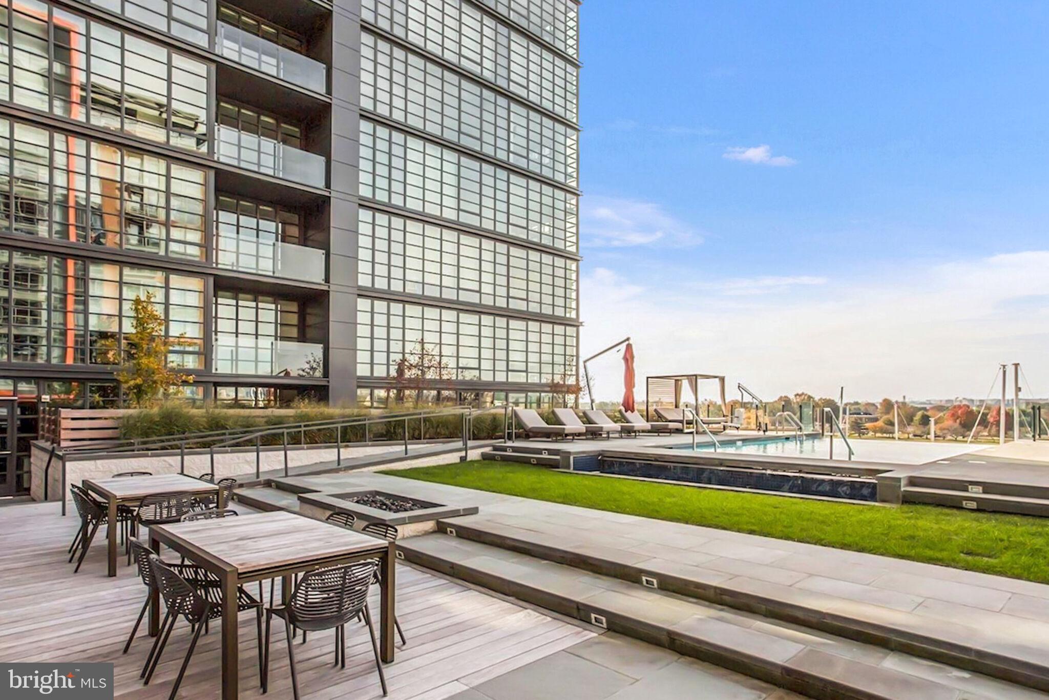 45 Sutton Square Southwest, Unit 607 Washington, DC 20024 - Photo 23 of 28 a view of swimming pool with outdoor seating and city view