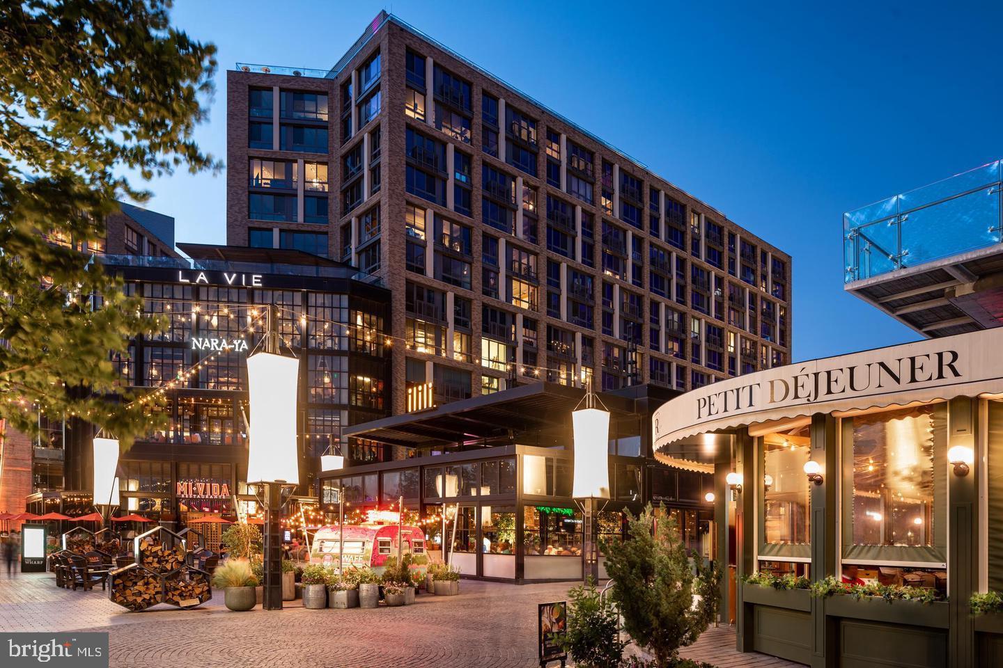 45 Sutton Square Southwest, Unit 607 Washington, DC 20024 - Photo 27 of 28 a city street lined with tall buildings