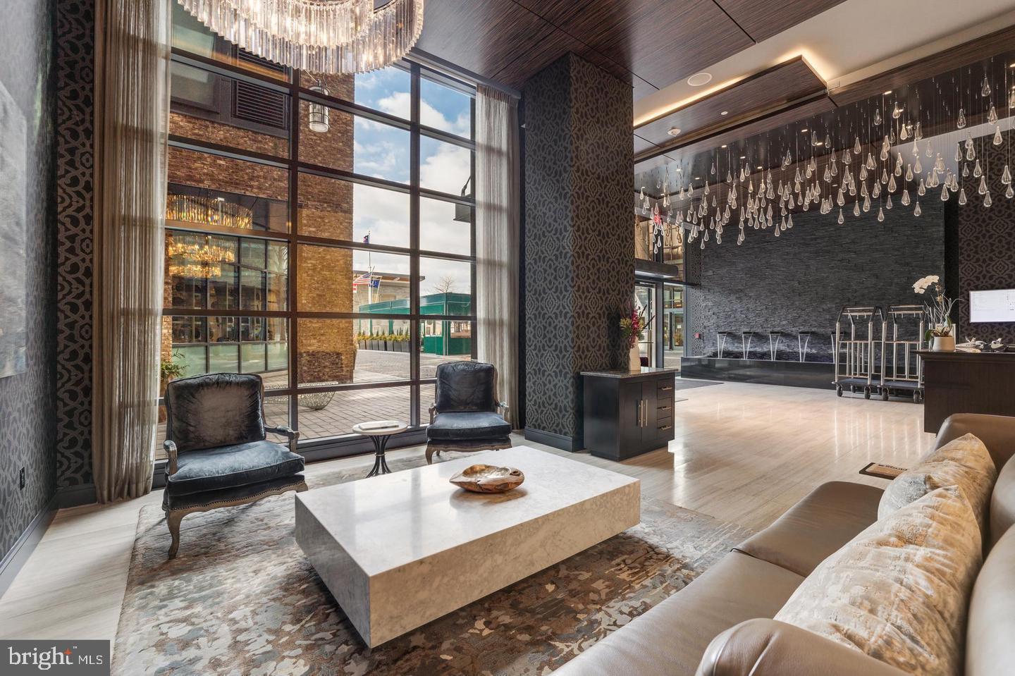 45 Sutton Square Southwest, Unit 607 Washington, DC 20024 - Photo 3 of 28 a living room with furniture and a large window