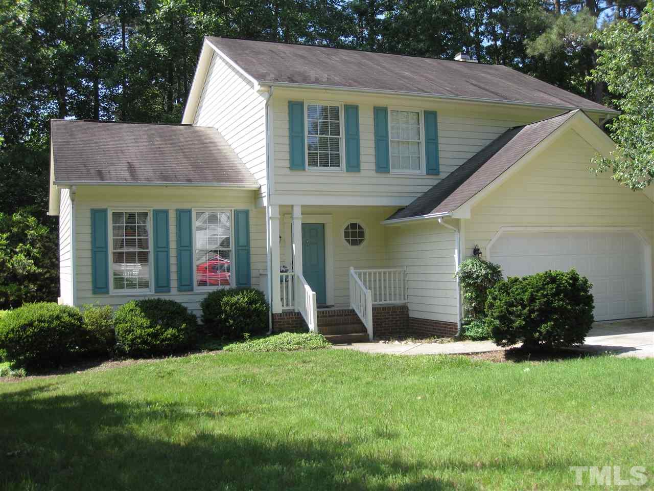 3313 Stone Castle Court Raleigh, NC 27613 - Photo 1 of 15 a view of a house with a yard plants and a table and chairs