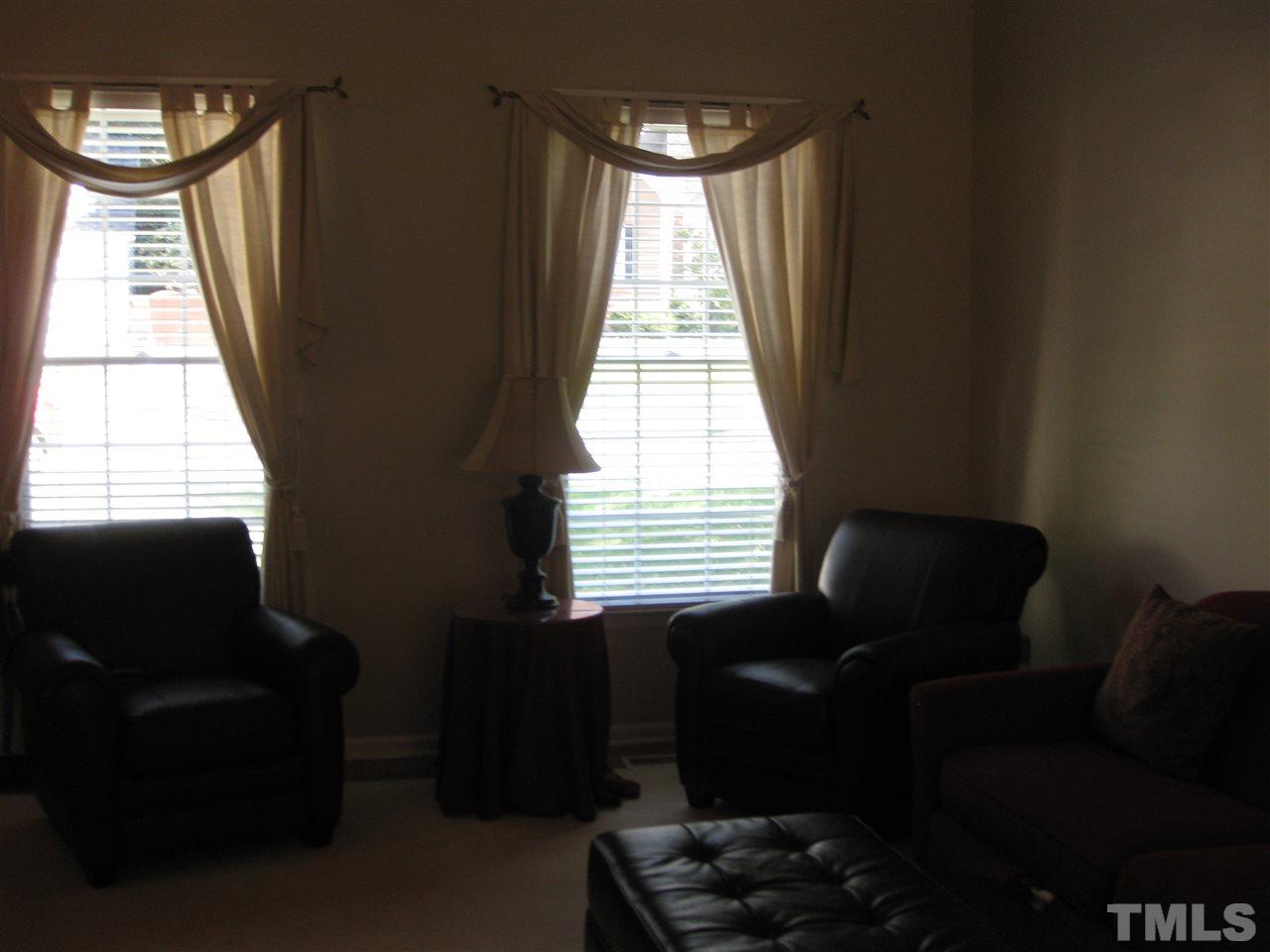 3313 Stone Castle Court Raleigh, NC 27613 - Photo 4 of 15 a living room with furniture and a window