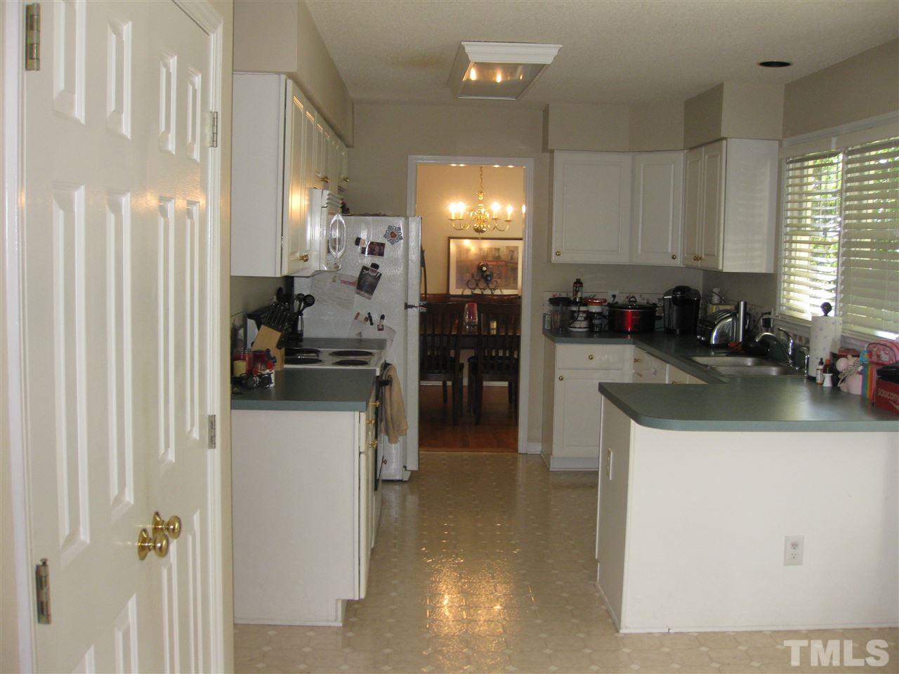 3313 Stone Castle Court Raleigh, NC 27613 - Photo 5 of 15 a kitchen with counter top space and appliances
