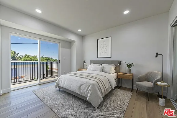 a bedroom with a bed and a couch