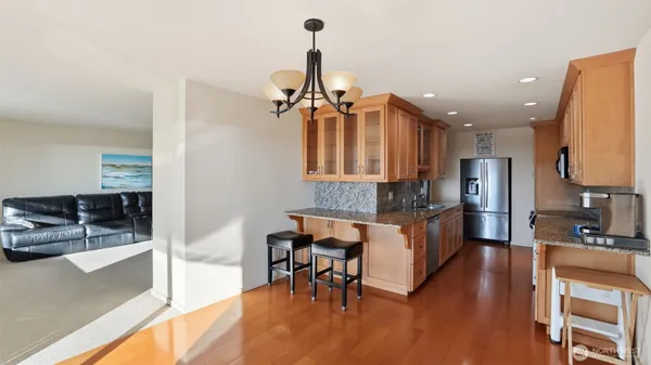 a kitchen with a table and chairs in it