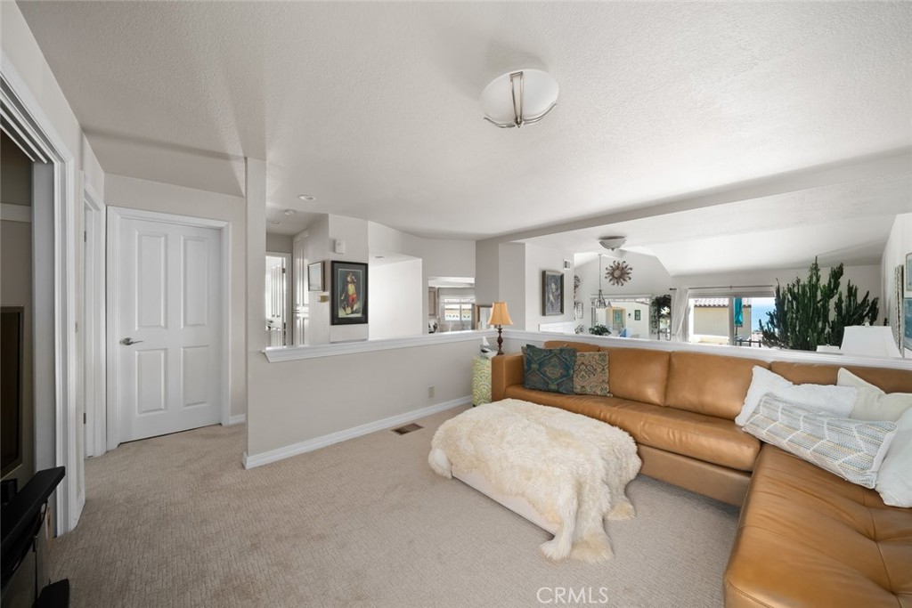 2100 Costa Del Sol Pismo Beach, CA 93449 - Photo 19 of 27 a living room with furniture and a flat screen tv