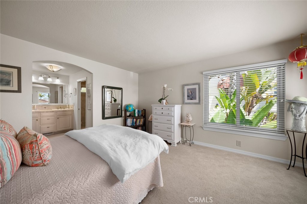 2100 Costa Del Sol Pismo Beach, CA 93449 - Photo 21 of 27 a spacious bedroom with a large bed and a large window