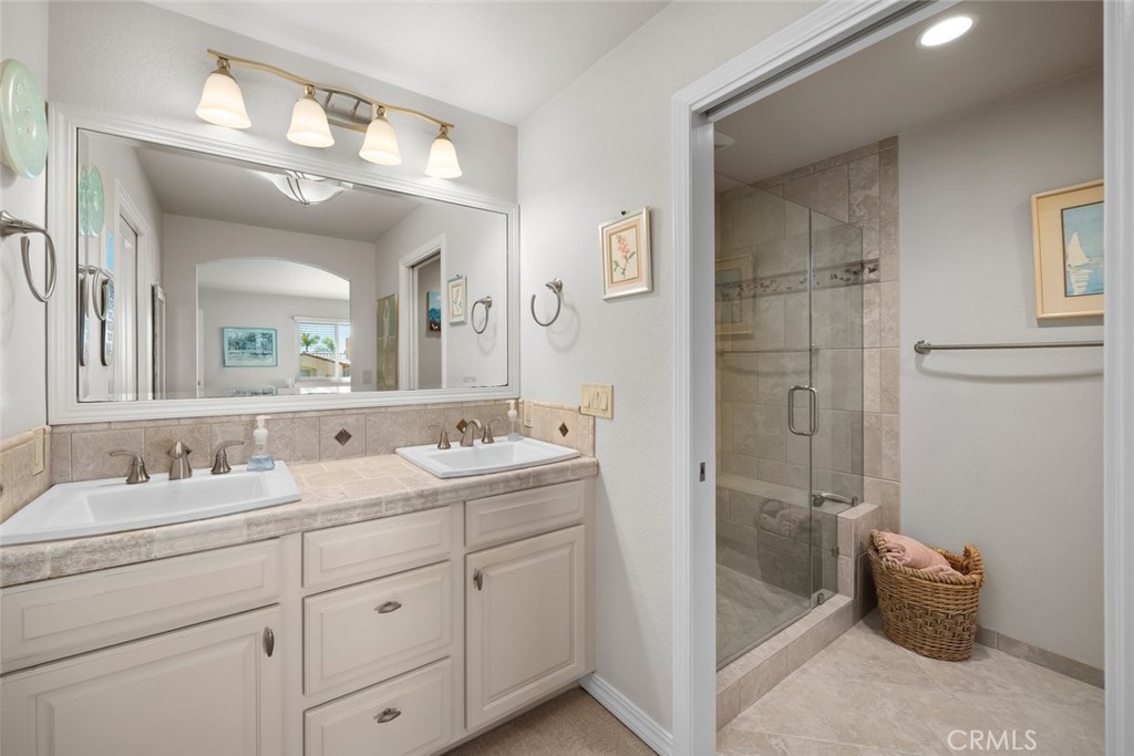 2100 Costa Del Sol Pismo Beach, CA 93449 - Photo 22 of 27 a en suite bathroom with a double vanity sink mirror and double