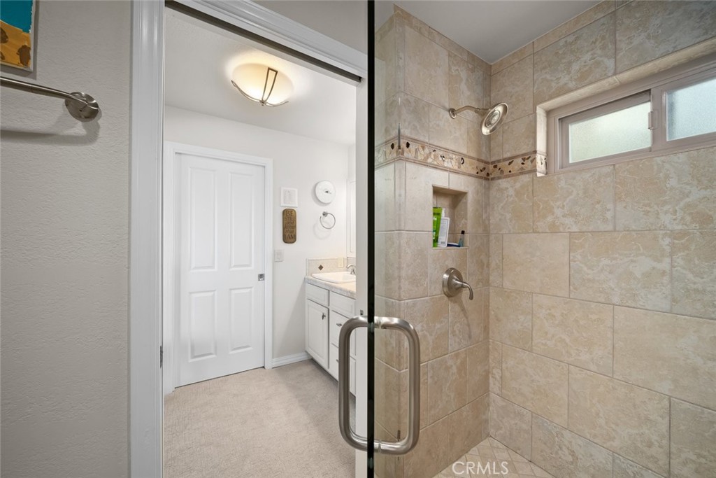 2100 Costa Del Sol Pismo Beach, CA 93449 - Photo 23 of 27 a bathroom with a shower and a mirror