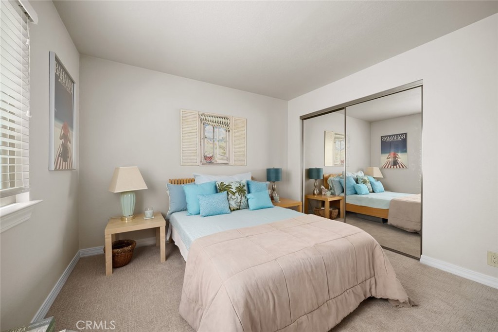 2100 Costa Del Sol Pismo Beach, CA 93449 - Photo 26 of 27 a bedroom with a bed and a lamp