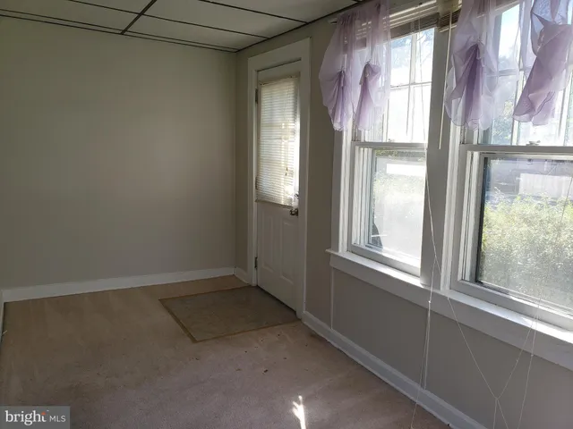 a view of empty room with windows