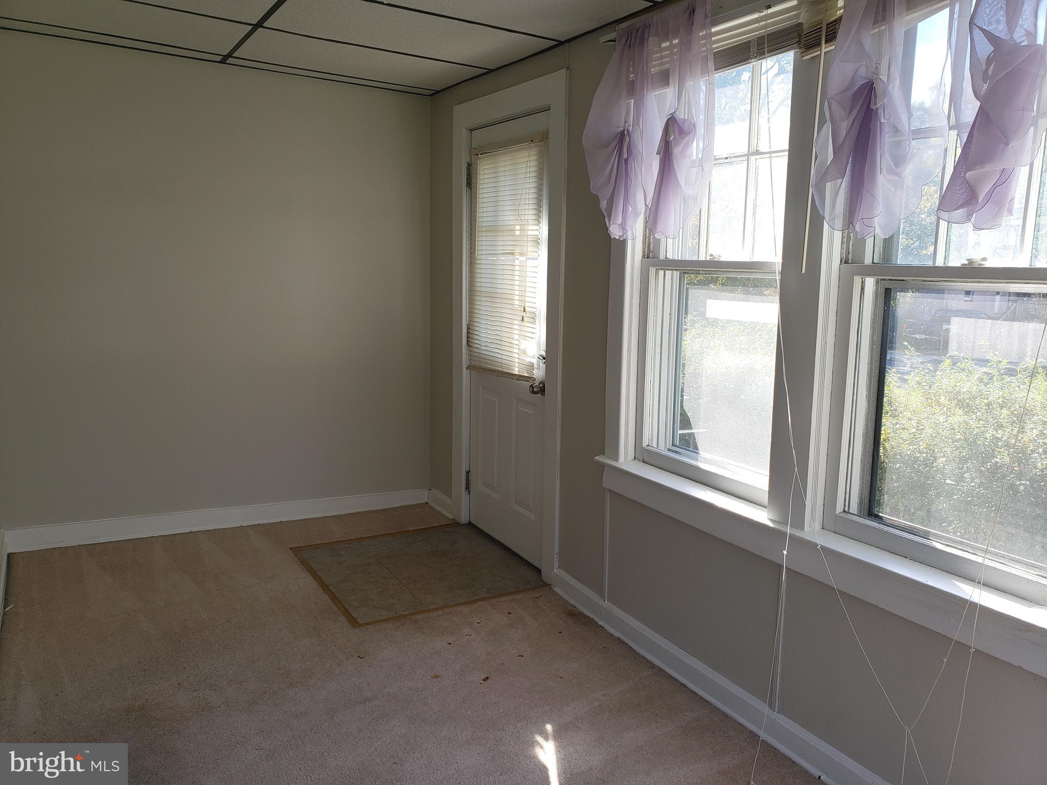 625 North Forklanding Road Maple Shade, NJ 08052 - Photo 3 of 16 a view of empty room with windows