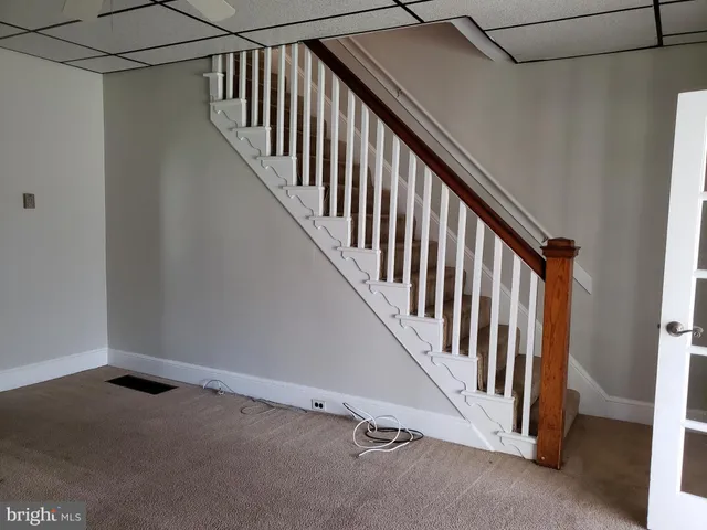 a view of a hallway with stairs