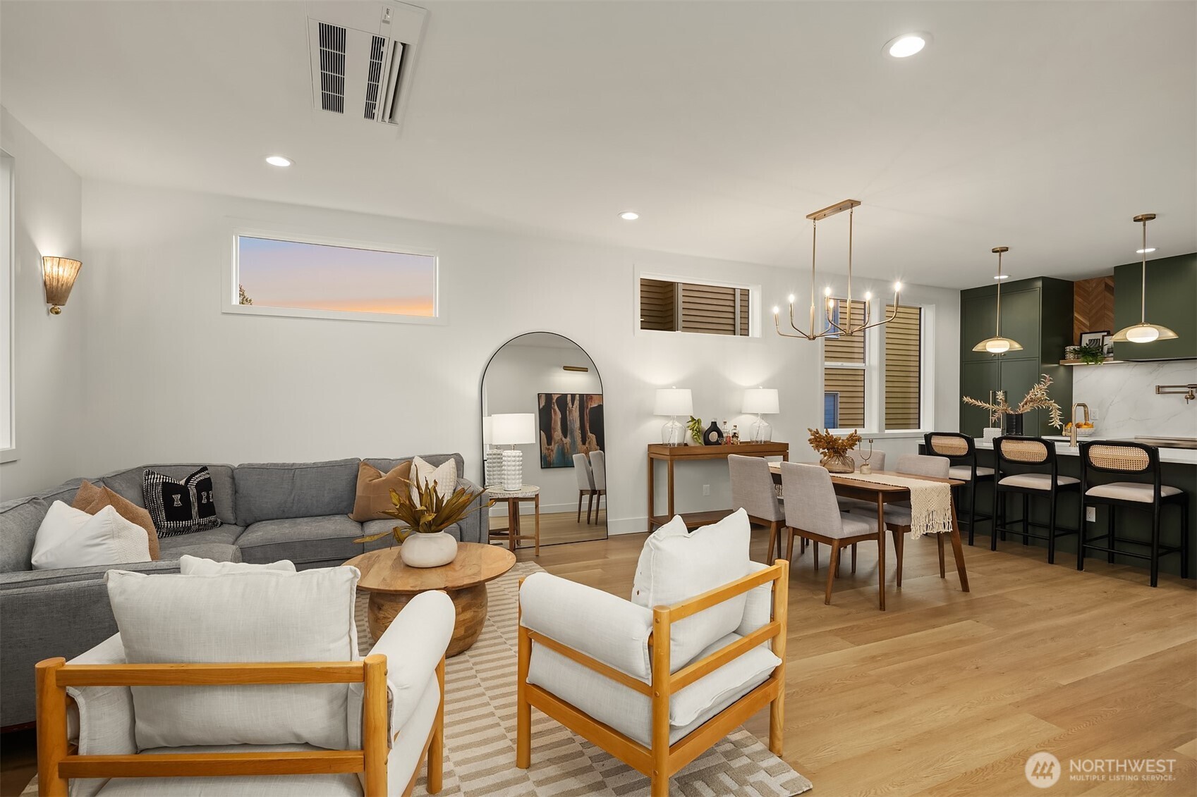 920 34th Avenue, Unit B Seattle, WA 98122 - Photo 15 of 38 a living room with furniture kitchen view and a wooden floor