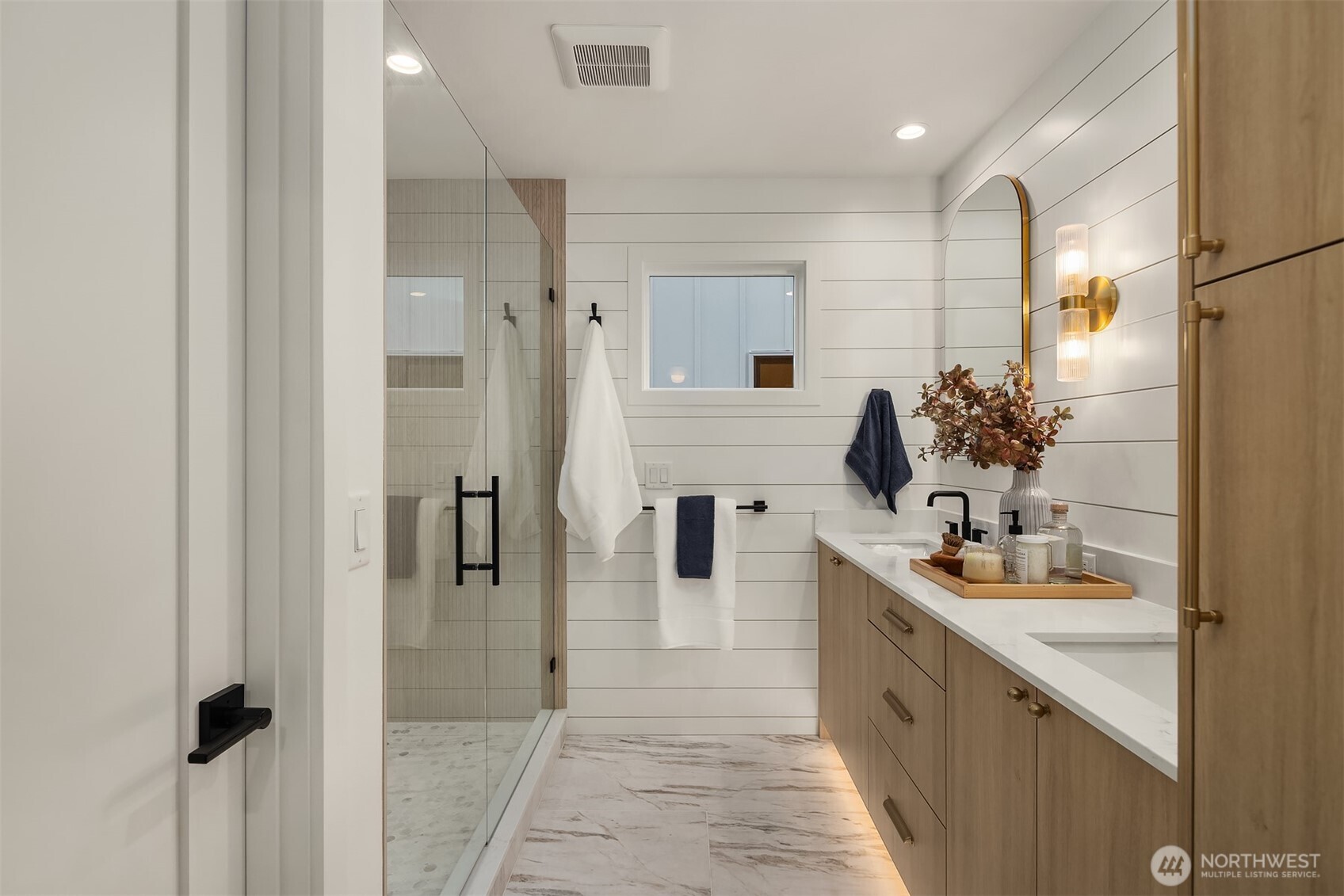 920 34th Avenue, Unit B Seattle, WA 98122 - Photo 21 of 38 a bathroom with a double vanity sink a mirror and shower