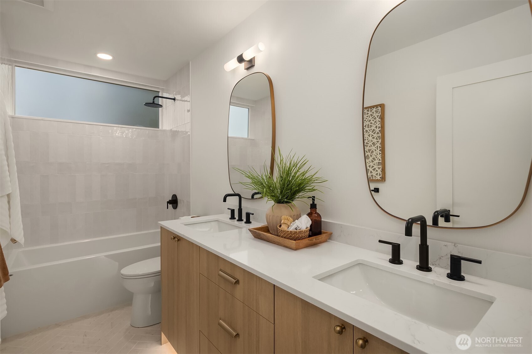 920 34th Avenue, Unit B Seattle, WA 98122 - Photo 27 of 38 a bathroom with a sink a toilet and shower
