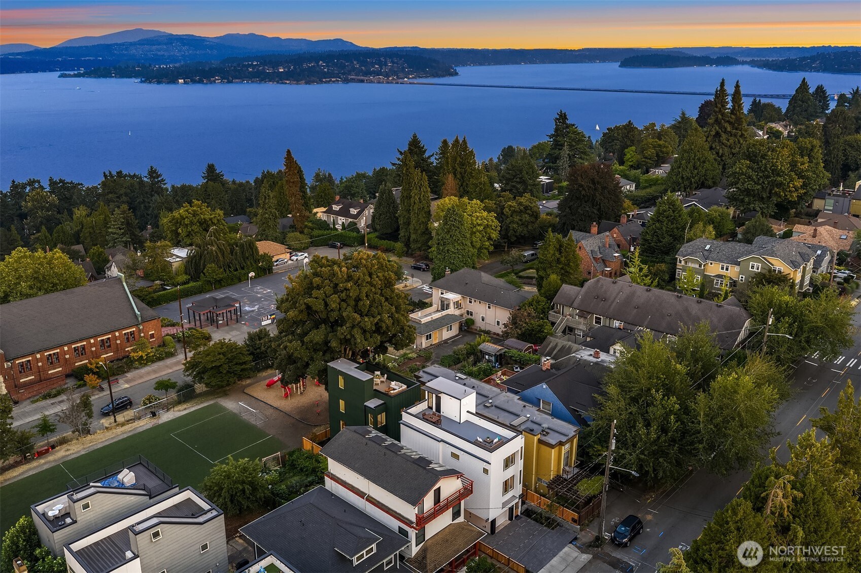 920 34th Avenue, Unit B Seattle, WA 98122 - Photo 34 of 38 an aerial view of a city with lots of residential buildings and lake view