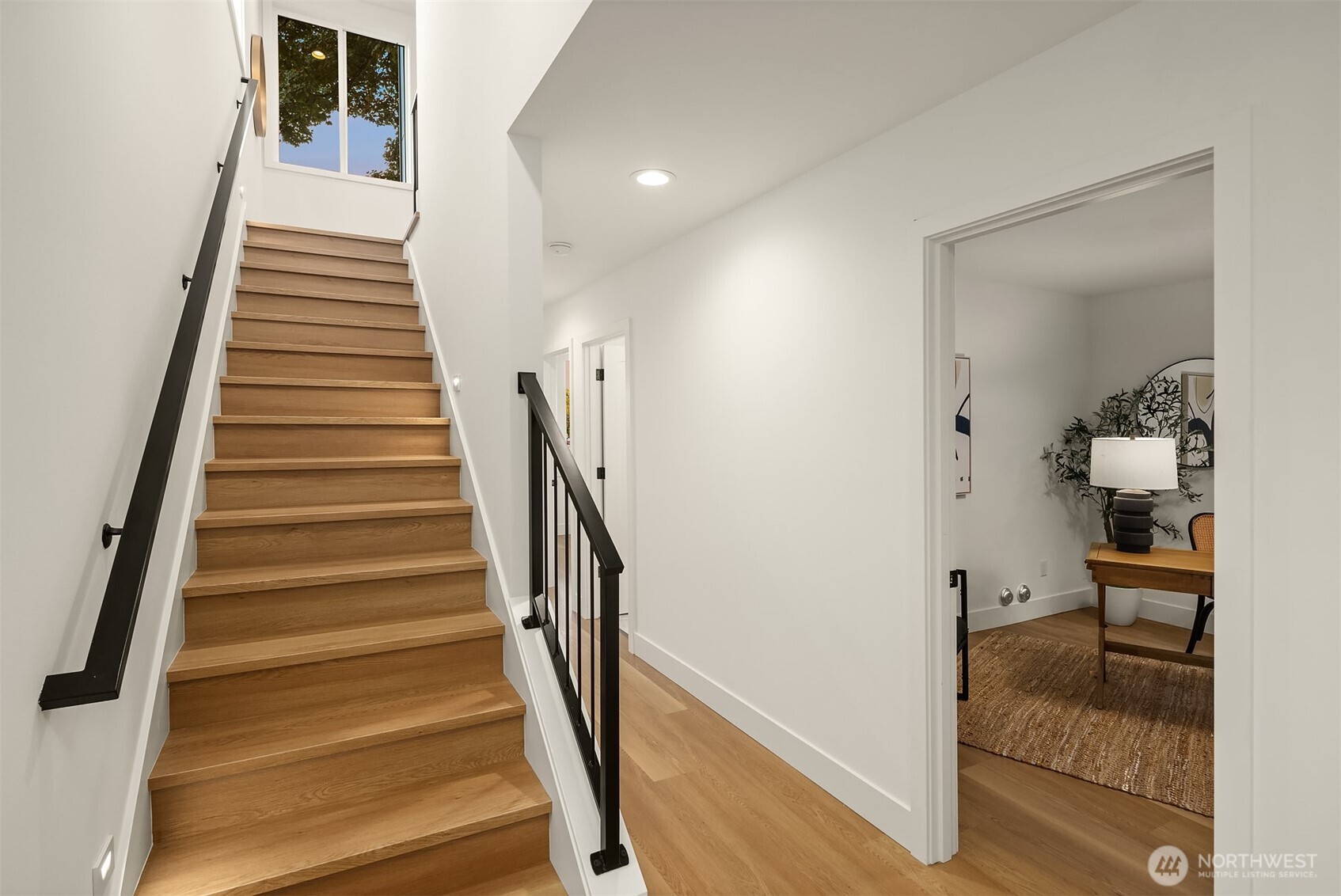 920 34th Avenue, Unit B Seattle, WA 98122 - Photo 38 of 38 a view of a hallway with wooden floor and staircase