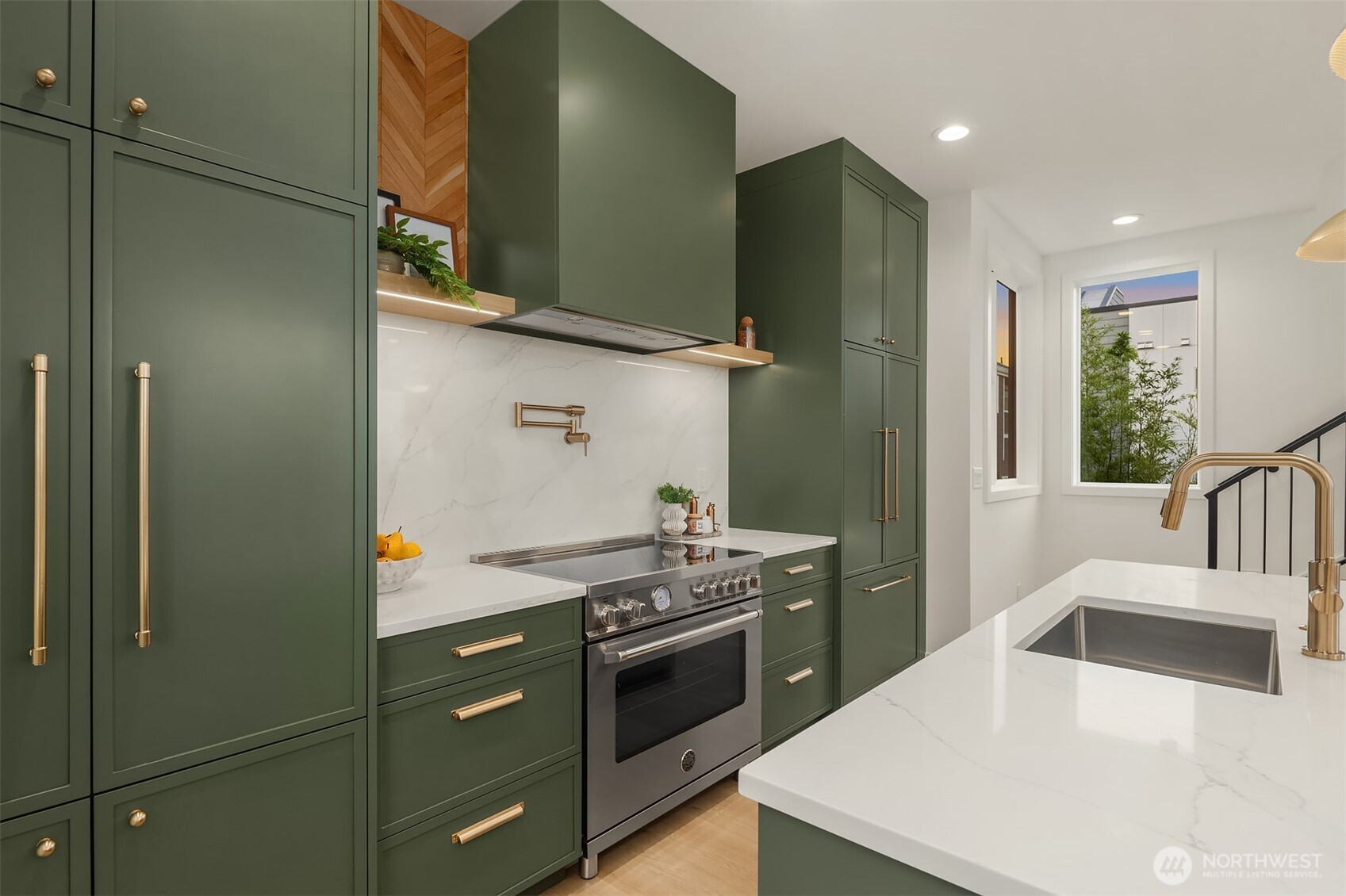 920 34th Avenue, Unit B Seattle, WA 98122 - Photo 10 of 38 a kitchen with stainless steel appliances a stove and a refrigerator