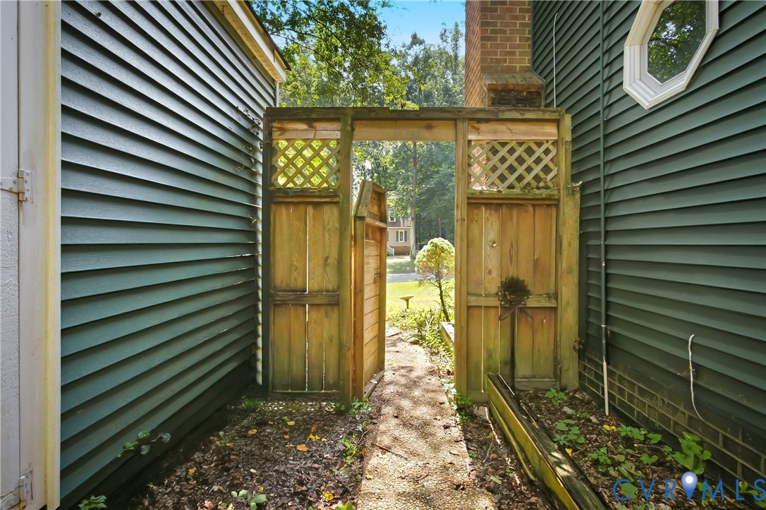 7224 Full Rack Drive Midlothian, VA 23112 - Photo 33 of 36 Wood privacy gate with lattice detailing, flanked