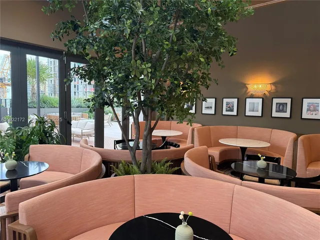 a outdoor space with patio couches and a potted plant