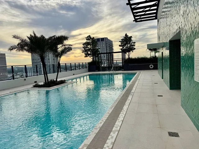 a view of swimming pool from a balcony