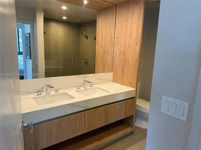 a bathroom with a sink a vanity and a mirror