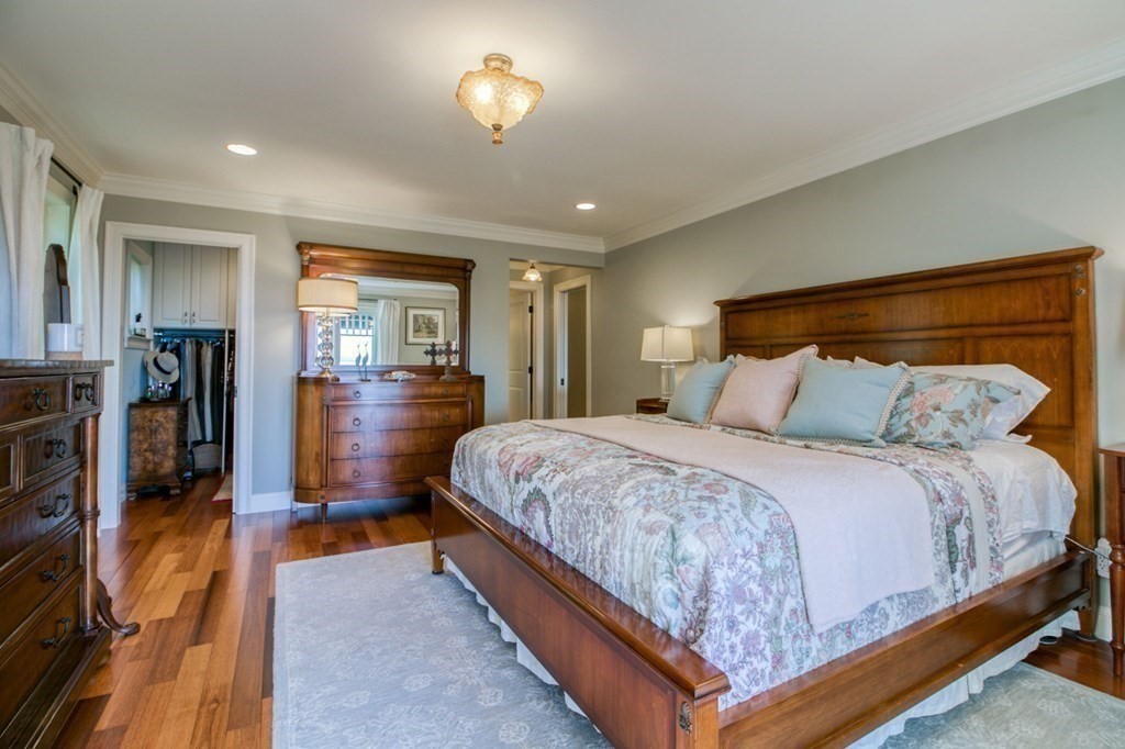 791 Ridge Road Wilbraham, MA 01095 - Photo 12 of 40 a spacious bedroom with a bed and a large mirror