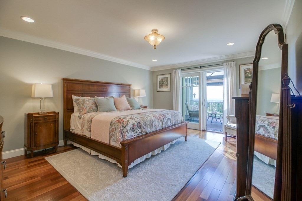 791 Ridge Road Wilbraham, MA 01095 - Photo 13 of 40 a bedroom with a bed and wooden floor