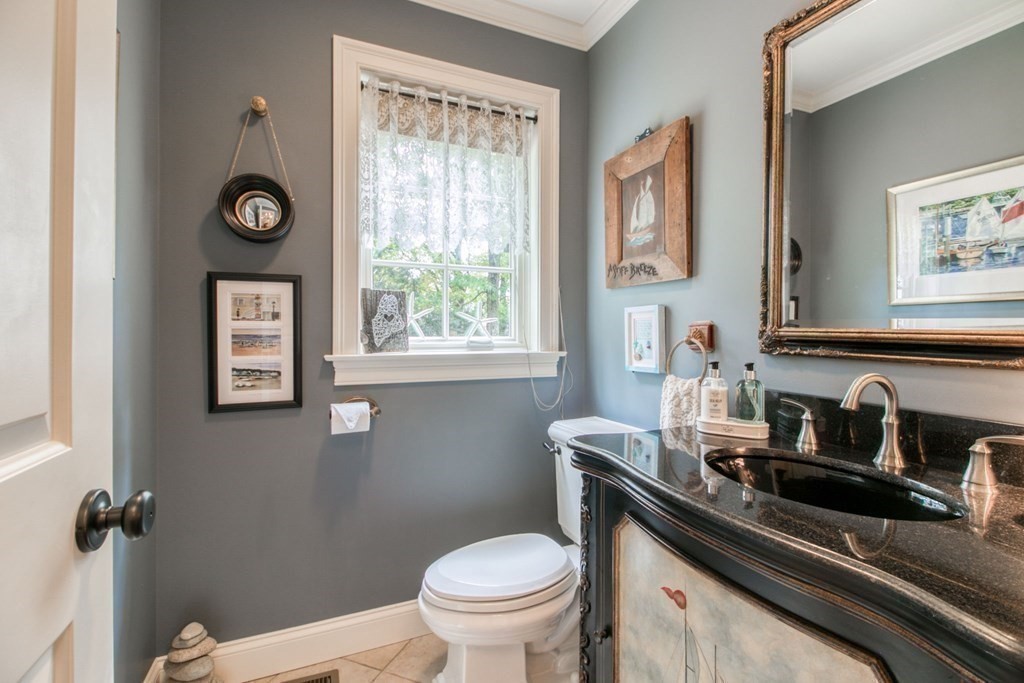 791 Ridge Road Wilbraham, MA 01095 - Photo 18 of 40 a bathroom with a toilet a sink and mirror