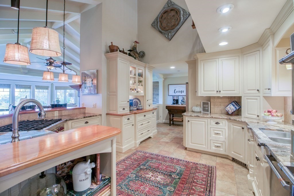 791 Ridge Road Wilbraham, MA 01095 - Photo 6 of 40 a kitchen with a sink counter top space and cabinets