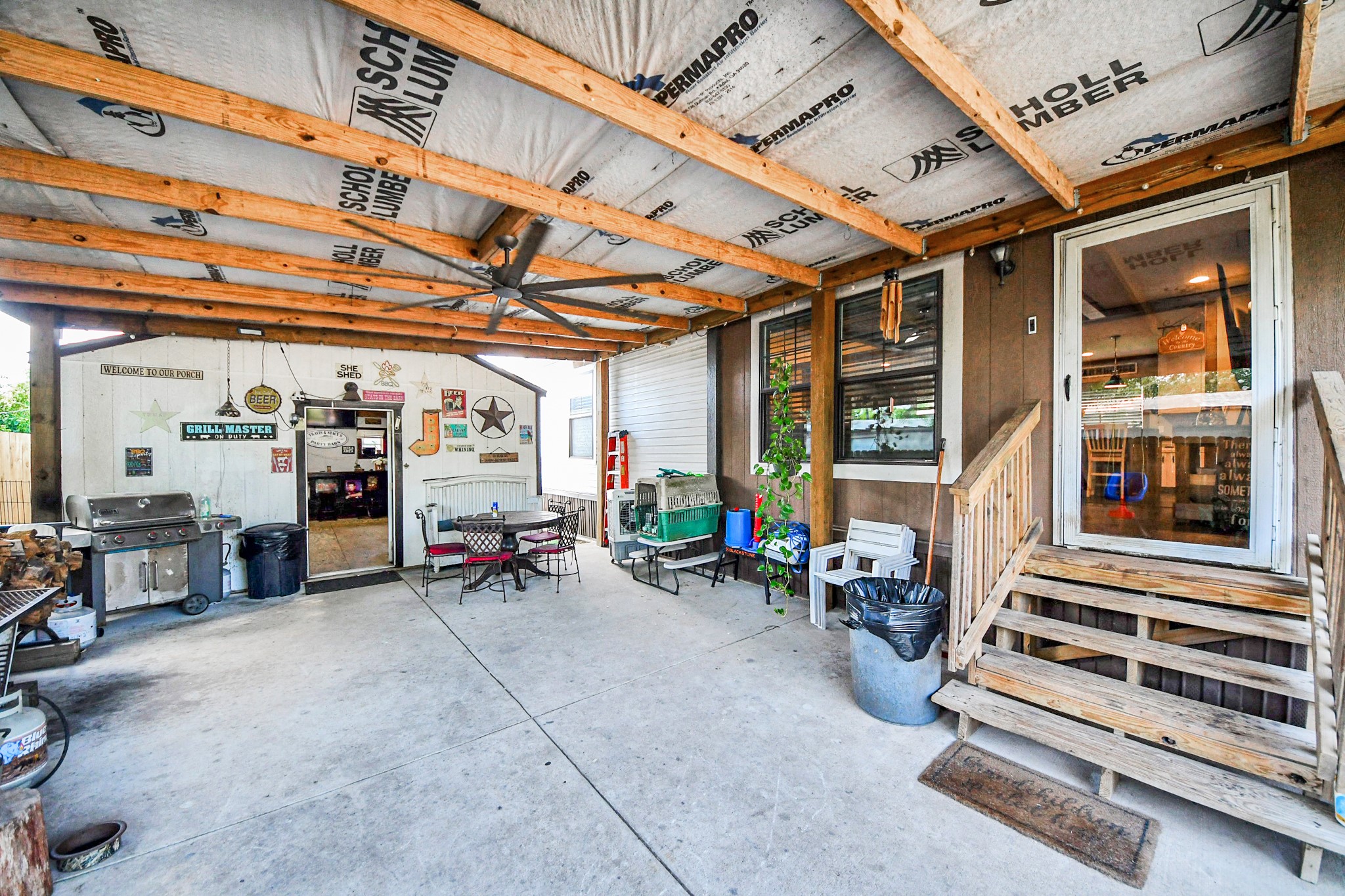 131 Kiowa Court Rosharon, TX 77583 - Photo 3 of 42 As you enter is a covered patio area with a rustic vibe ideal for outdoor entertaining.