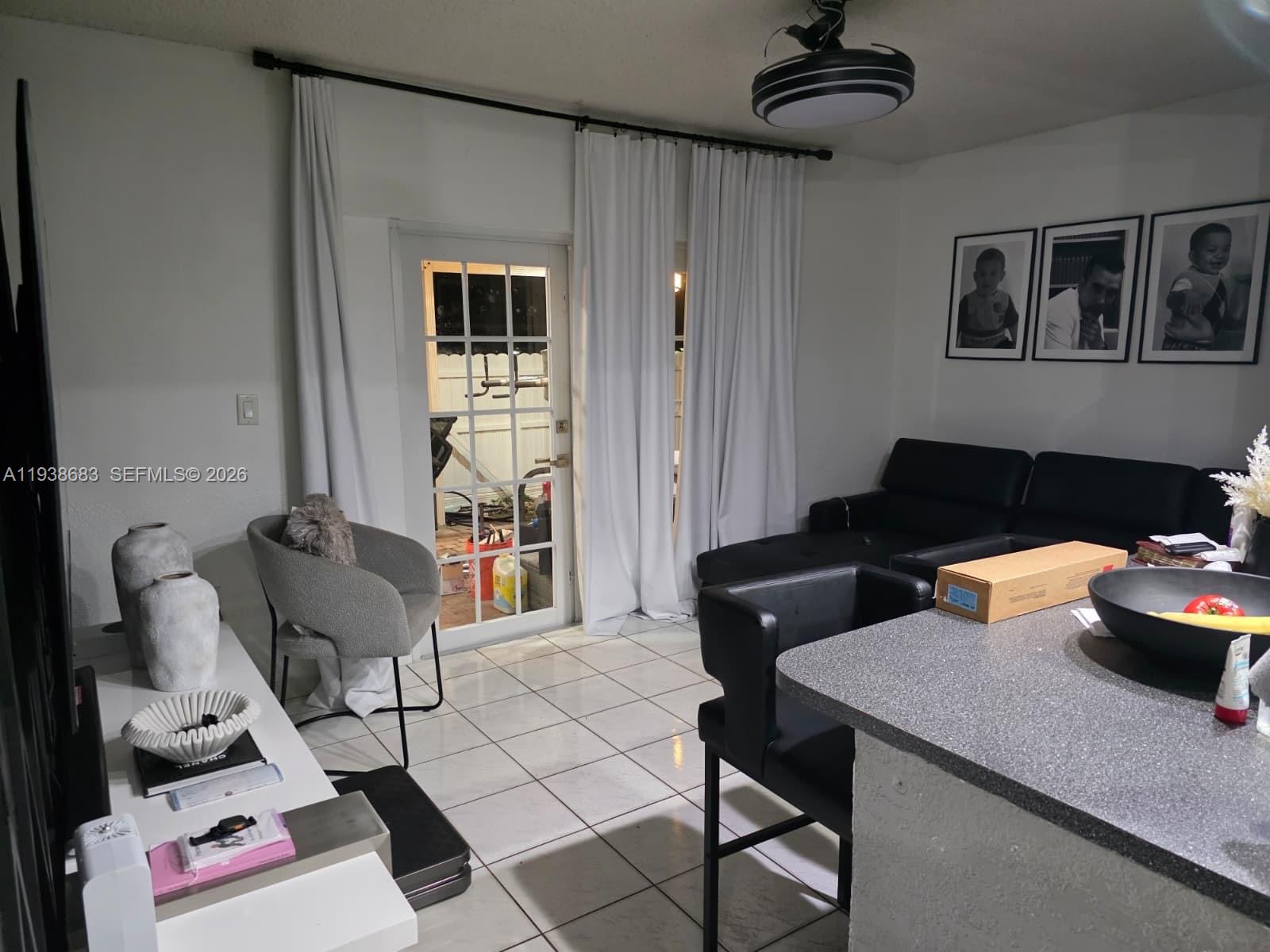 4837 Southwest 144th Court Miami, FL 33175 - Photo 4 of 10 a living room with furniture and a window