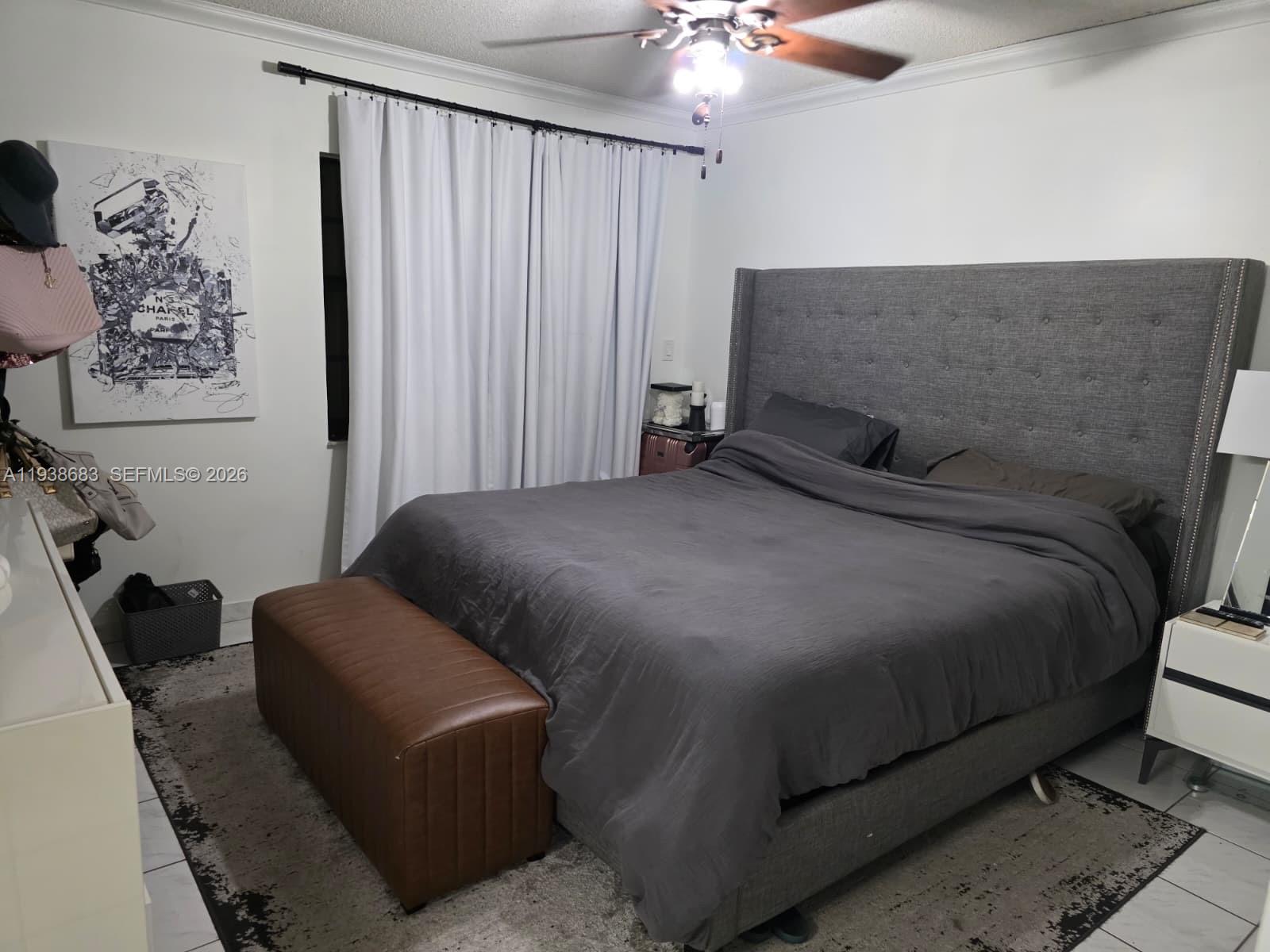 4837 Southwest 144th Court Miami, FL 33175 - Photo 6 of 10 a bedroom with a bed and a chandelier