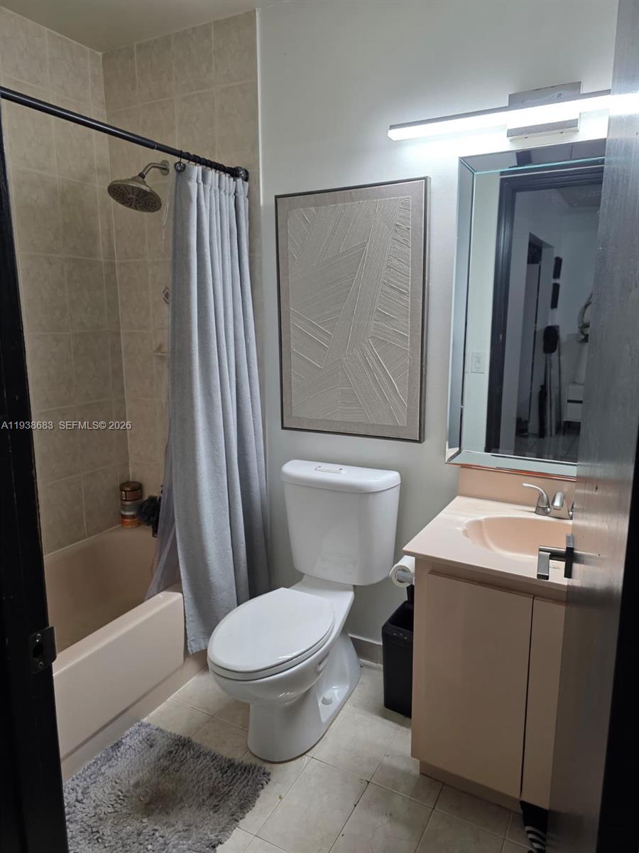 4837 Southwest 144th Court Miami, FL 33175 - Photo 7 of 10 a bathroom with a sink toilet and shower