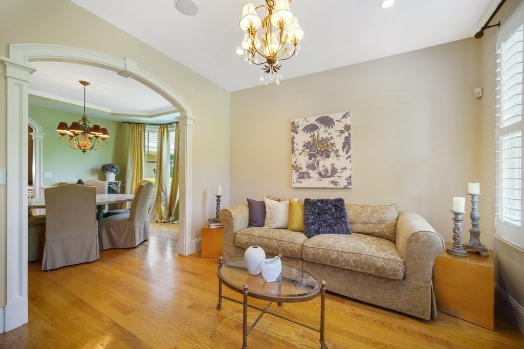19 Marked Tree Road Sudbury, MA 01776 - Photo 12 of 42 a living room with furniture and a chandelier