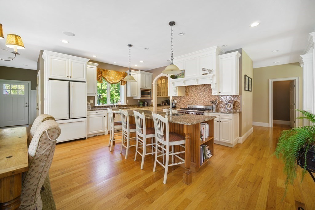 19 Marked Tree Road Sudbury, MA 01776 - Photo 15 of 42 a view of a dining room with furniture window and wooden floor
