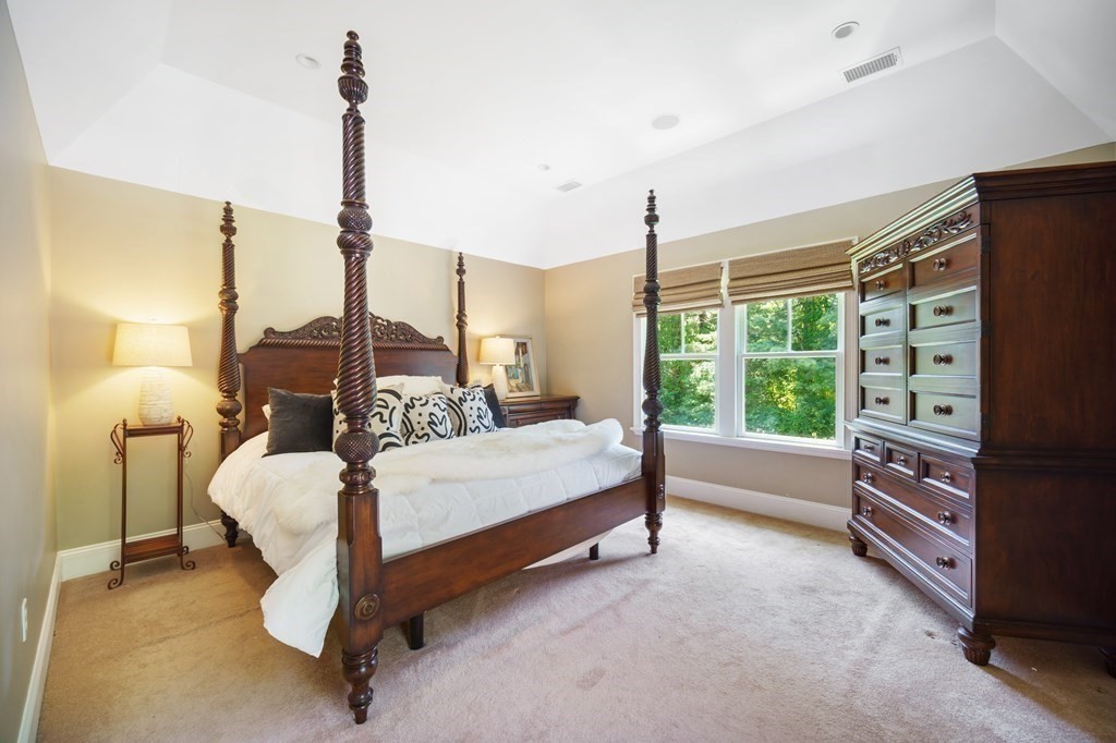 19 Marked Tree Road Sudbury, MA 01776 - Photo 17 of 42 a bed room with a bed and large window