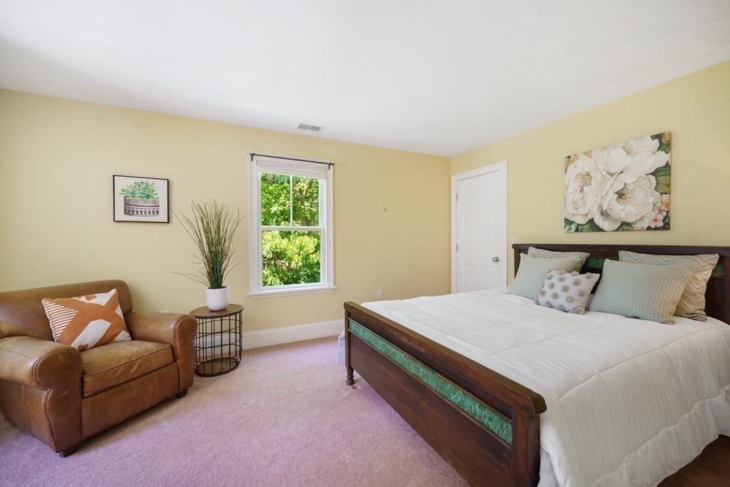 19 Marked Tree Road Sudbury, MA 01776 - Photo 20 of 42 a bedroom with a bed couch and window