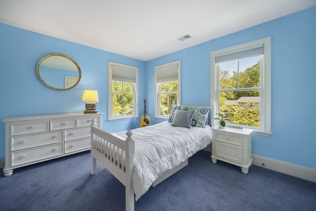 19 Marked Tree Road Sudbury, MA 01776 - Photo 24 of 42 a bedroom with a bed and a window