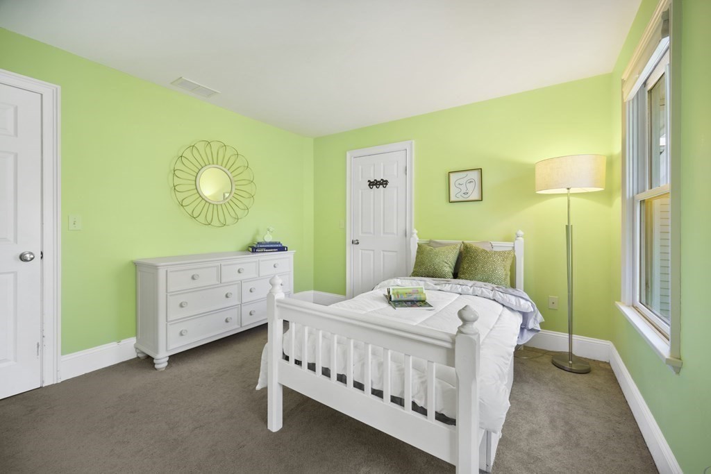 19 Marked Tree Road Sudbury, MA 01776 - Photo 25 of 42 a bedroom with a bed and a table