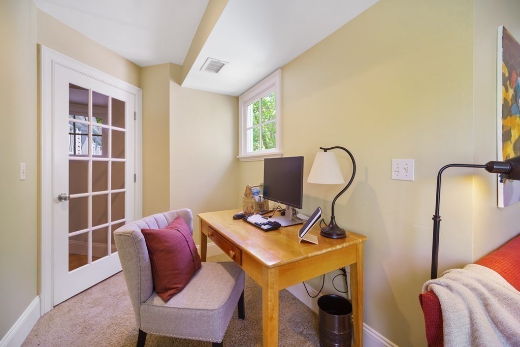 19 Marked Tree Road Sudbury, MA 01776 - Photo 28 of 42 a view of a workspace with furniture and a window