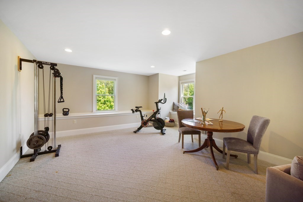 19 Marked Tree Road Sudbury, MA 01776 - Photo 30 of 42 a living room with furniture a window and gym equipment