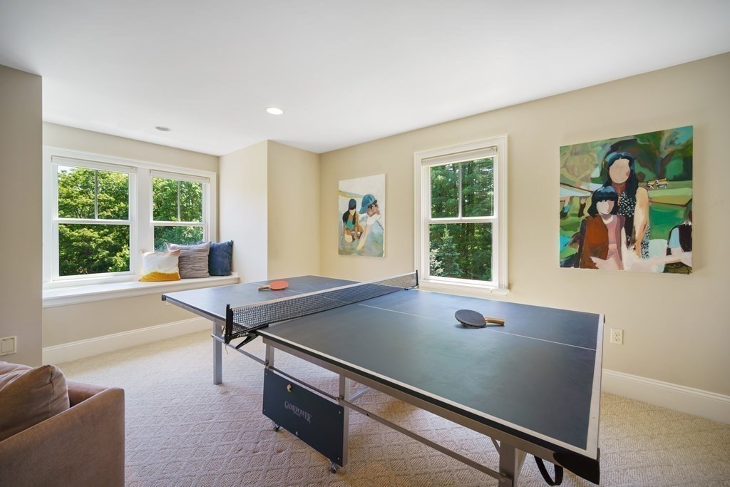 19 Marked Tree Road Sudbury, MA 01776 - Photo 31 of 42 a living room with furniture pool table and a large window