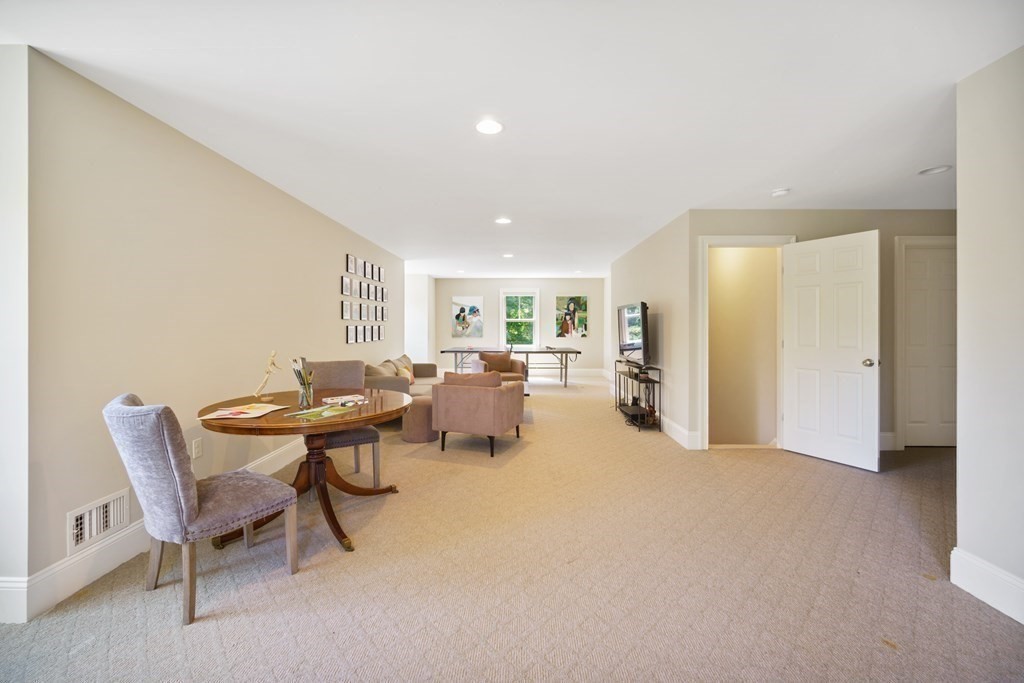 19 Marked Tree Road Sudbury, MA 01776 - Photo 32 of 42 a living room with furniture and a table