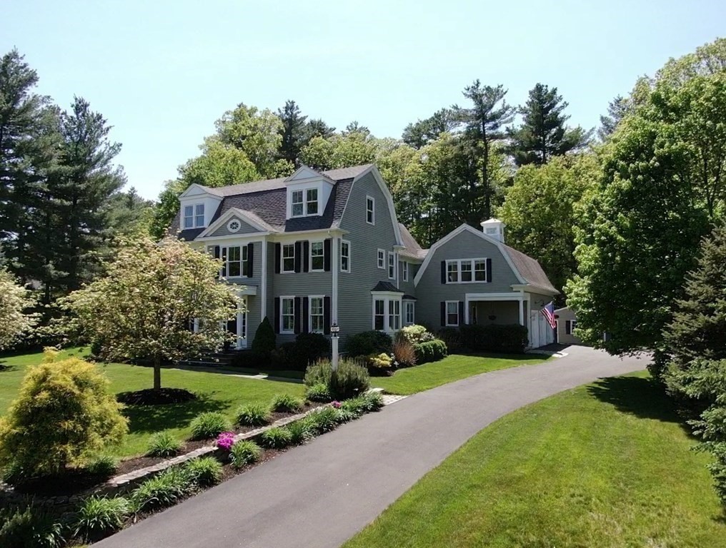 19 Marked Tree Road Sudbury, MA 01776 - Photo 34 of 42 a front view of a house with a garden and trees
