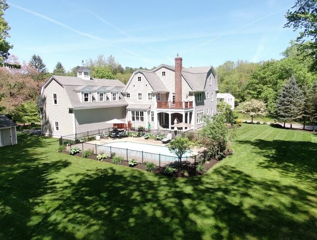 19 Marked Tree Road Sudbury, MA 01776 - Photo 36 of 42 a aerial view of a house with swimming pool and garden